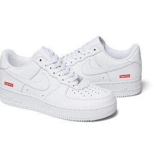 Supreme White Athletic Shoes with Red Highlights
